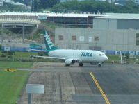 ZK-TLE @ YBBN - Parked at southern end of airfield. - by magnaman