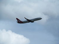 VH-VZT @ YBBN - taken through lounge window - by magnaman