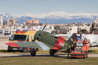 EC-JRK @ LECU - On tow into the display area before the monthly air display of the Fundación Infante de Orleans, at Cuatro Viantos, Madrid. I like the humour behind the mock radiator of the tug - which resembles that of a certain British luxury car maker...