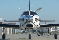 UNKNOWN @ KSQL - A transient Piper Malibu JetProp sits in the evening sun just after arriving at San Carlos. - by Chris L.