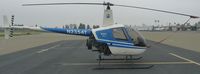 N2354T @ KRHV - A transient 1992 Robinson R22 Beta sits at the transient ramp on a very overcast morning at Reid-Hillview. - by Chris L.