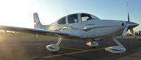 N685CD @ KRHV - A transient 2006 Cirrus SR22 sits at the transient ramp with a beautiful sunset at Reid Hillview. - by Chris L.