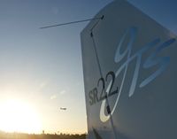N685CD @ KRHV - A transient 2006 Cirrus SR22 sits at the transient ramp with a beautiful sunset at Reid Hillview. - by Chris L.