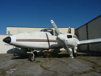 N14012 @ KRHV - An old local Piper Aztec sits next to one of the T hangars at Reid Hillview. Believe it or not, this plane actually flies every once in a while. It's used for air photography. - by Chris L.