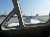 N2616X @ KRHV - A side view out the cockpit window of the transient Cessna 414A, N2616X. - by Chris L.