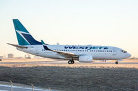 C-FGWJ @ CYYZ - Holding short of 06L prior to departure from Toronto Pearson - by BlindedByTheFlash