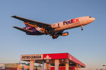 N366FE @ CYYZ - Short final for runway 23 at Toronto Pearson during golden hour - by Robert Jones
