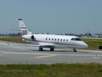 N738QS @ KSJC - One of NetJets 2008 Gulftream 200's taxing to runway 30L at San Jose International. - by Chris L.