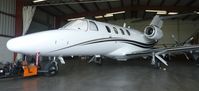 UNKNOWN @ KRHV - A local Cessna Citation Jet 1 sitting inside the Lafferty Aircraft Sales hangar. - by Chris L.