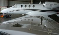 UNKNOWN @ KRHV - A local Cessna Citation Jet 1 sitting inside the Lafferty Aircraft Sales hangar. - by Chris L.