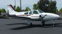 N1014W @ KRHV - A local 1973 Beechcraft Baron 55 sitting in front of the Lafferty Aircraft Sales hangar. - by Chris L.