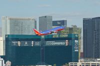 N649SW @ KLAS - Southwest Airlines, is here passing the MGM Grand Hotel during take off climb at Las Vegas(KLAS) - by A. Gendorf