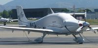 N422TB @ KLVK - A transient 2006 Cirrus SR22 sitting on the transient ramp at Livermore Municipal Airport. - by Chris L.