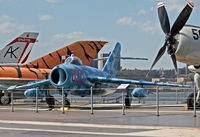 0327 - Nice to see this aircraft so beautifully repainted. It sits next to a former nemesis, the Douglas Skyraider. - by Daniel L. Berek
