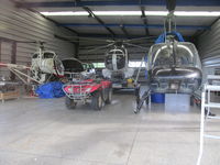 ZK-HBB @ NZKK - Closest to camera - plus HGS and HRL in roadside hangar on SH10 in KeriKeri - by magnaman