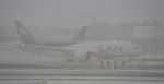 CC-BBJ @ KLAX - Departing LAX on 7L in heavy rain. - by Todd Royer