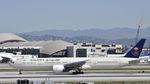 HZ-AK20 @ KLAX - Taxiing to gate at LAX - by Todd Royer