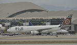 DQ-FJT @ KLAX - Being towed to remote parking - by Todd Royer