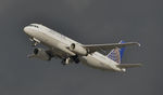 N483UA @ KLAX - Departing LAX on a stormy day - by Todd Royer