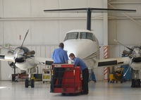 N200WB @ KAPC - The ground crew pulling out a beautiful 2001 King Air B200 from its hangar to go out to the run up area to test some buttons. - by Chris Leipelt