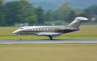 OE-HII @ LOWG - Challenger 300, wet take-off - by Paul H