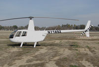 N7189Z @ KTLR - SMD Vineyards (Salinas, CA) Robinson R44 @ Mefford Field (Tulare, CA) for 2014 International Ag Expo - by Steve Nation