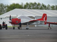 ZK-TGN @ NZAR - towing out of hangar - by magnaman