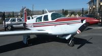 N57032 @ KRHV - A 1983 Mooney M20K sitting beside the Lafferty hangar waiting to be sold at Reid Hillview Airport, CA. - by Chris Leipelt
