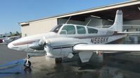 N566KK @ KRHV - A local 1966 Beechcraft D95 getting a wash at Reid Hillview Airport, CA. - by Chris Leipelt