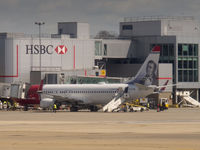 EI-FHB @ EGKK - On stand at Gatwick (taken at a distance through a BA Airbus window) - by alanh