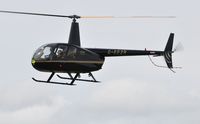 G-EEZR @ EGFH - Visiting R44 Raven II. - by Roger Winser