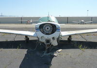 N2934L @ KRHV - A local 1967 Mooney M20C rotting at its usual parking spot at Reid Hillview Airport, CA. Believe it or not this guy still pays his parking fee. - by Chris Leipelt