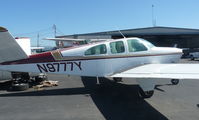 N9777Y @ KRHV - A local 1963 Beechcraft Bonanza P35 parked near Squadron 2 for maintenance at Reid Hillview Airport, CA. - by Chris Leipelt