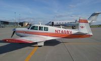 N7408V @ KGFK - Mooney M20F on the ramp.