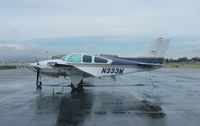 N333W @ KRHV - A transient 1979 Beechcraft Baron E-55 (GRECMAR AIR INC - WILMINGTON, DE) sitting at the transient ramp in between rainstorms at Reid Hillview Airport, CA. - by Chris Leipelt