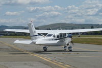 N615KE @ KRHV - A local 2004 Cessna T206H taxing our from its hangar and getting ready to depart at Reid Hillview Airport, CA. - by Chris Leipelt