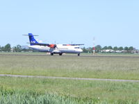 OY-JZE @ EHAM - Schiphol Airport , Landing - by Henk Geerlings