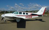 N3121W @ KRHV - A transient 1973 Beechcraft Baron 58 (MINDEN, NV) parked at the south tie downs at Reid Hillview Airport, CA. The pilot of this aircraft had another Baron 55 (N7982R). But when that Baron was gone for a few weeks, this one showed up, with the same pilot! - by Chris Leipelt