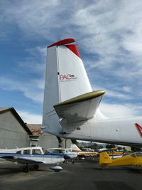 N5383G @ SZP - 1967 Helio HT-295/U-10D SUPER COURIER, Lycoming GO-480 295 Hp, tail logo of operator, Note substantial rudder & vertical stabilizer - by Doug Robertson