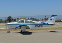 N20CA @ KRHV - Cal Trans 1969 Beech Bonanza 33A visiting Reid Hillview Airport, CA for a board meeting, taxing to transient parking. - by Chris Leipelt