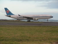B-6515 @ NZAA - landing at dusk at AKL - by magnaman