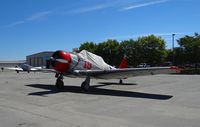 N2269U @ E16 - A North American SNJ-4 from nearby Reid Hillview Airport visiting South County Airport, CA. Parked at Magnum Aviation's transient parking. - by Chris Leipelt