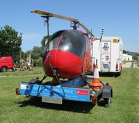 G-GDAY - Off airport. Grounded R-22 Beta helicopter used to raise funds for the Wales Air Ambulance charity in position by the Swansea foreshore ready for the Wales National Airshow 2015. - by Roger Winser