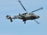 ZZ380 - Off airport. A Wildcat of the Royal Navy Helicopter Display Team Black Cats during a solo display on the first day of the Wales National Airshow held over Swansea Bay. Operated by 825 NAS.  - by Roger Winser
