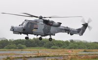 ZZ396 @ EGFH - A Wildcat of the Royal Navy Helicopter Display Team Black Cats arriving at the airport prior to displaying with ZZ515 on the second day of the Wales National Airshow. Operated by 825 NAS. - by Roger Winser