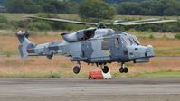 ZZ515 @ EGFH - Wildcat of the Royal Navy Helicopter Display Team Black Cats arriving at the airport to join ZZ396 prior to displaying on the second day of the Wales National Airshow. Operated by 825 NAS. - by Roger Winser