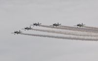G-MAXV - Off airport. Raven 1 leading Team Raven in 'Big vic' formation on the first day of the Wales National Airshow held over Swansea Bay. - by Roger Winser