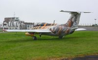 RA-01611 @ EGFH - Tiger marked Delfin on static display at the airport. Spuriously marked as G-STNR, the registration allocated to a Yakovlev Yak-52. - by Roger Winser