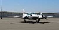 N7289R @ KRHV - A locally based 1975 Beechcraft Baron 55 parked at the south tie downs at Reid Hillview Airport, CA. - by Chris Leipelt