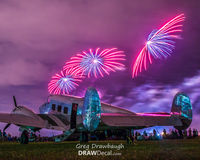N1939K @ KOSH - Three alien spacecraft hovered over Beech 18 N1939K during the Wednesday night airshow at Oshkosh 2015 - by Greg Drawbaugh